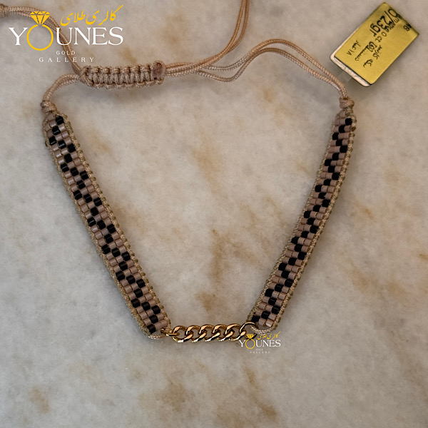 دستبند میوکی کارتیر طلا کرم زیکزاکی